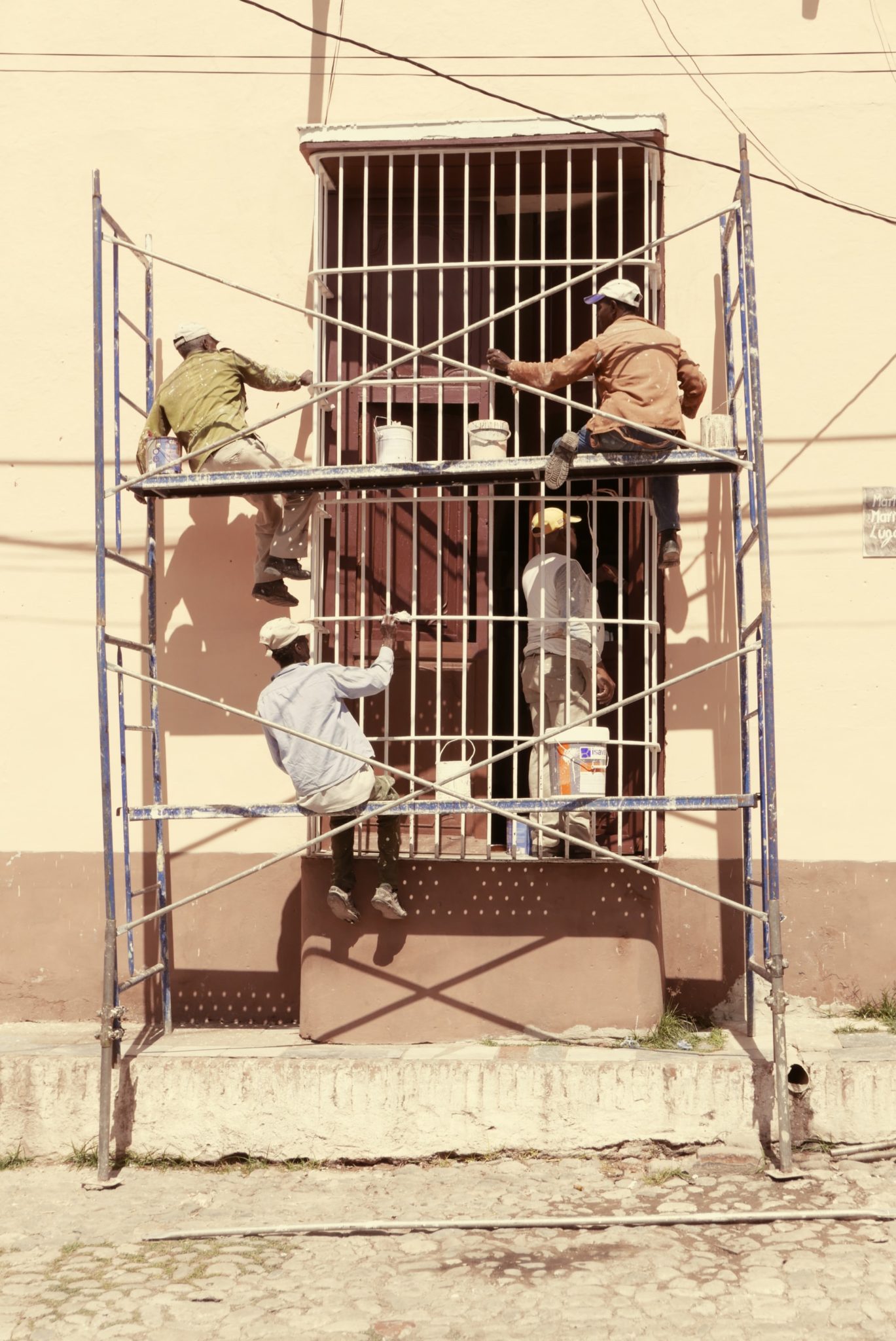 Four men working on scaffold tower